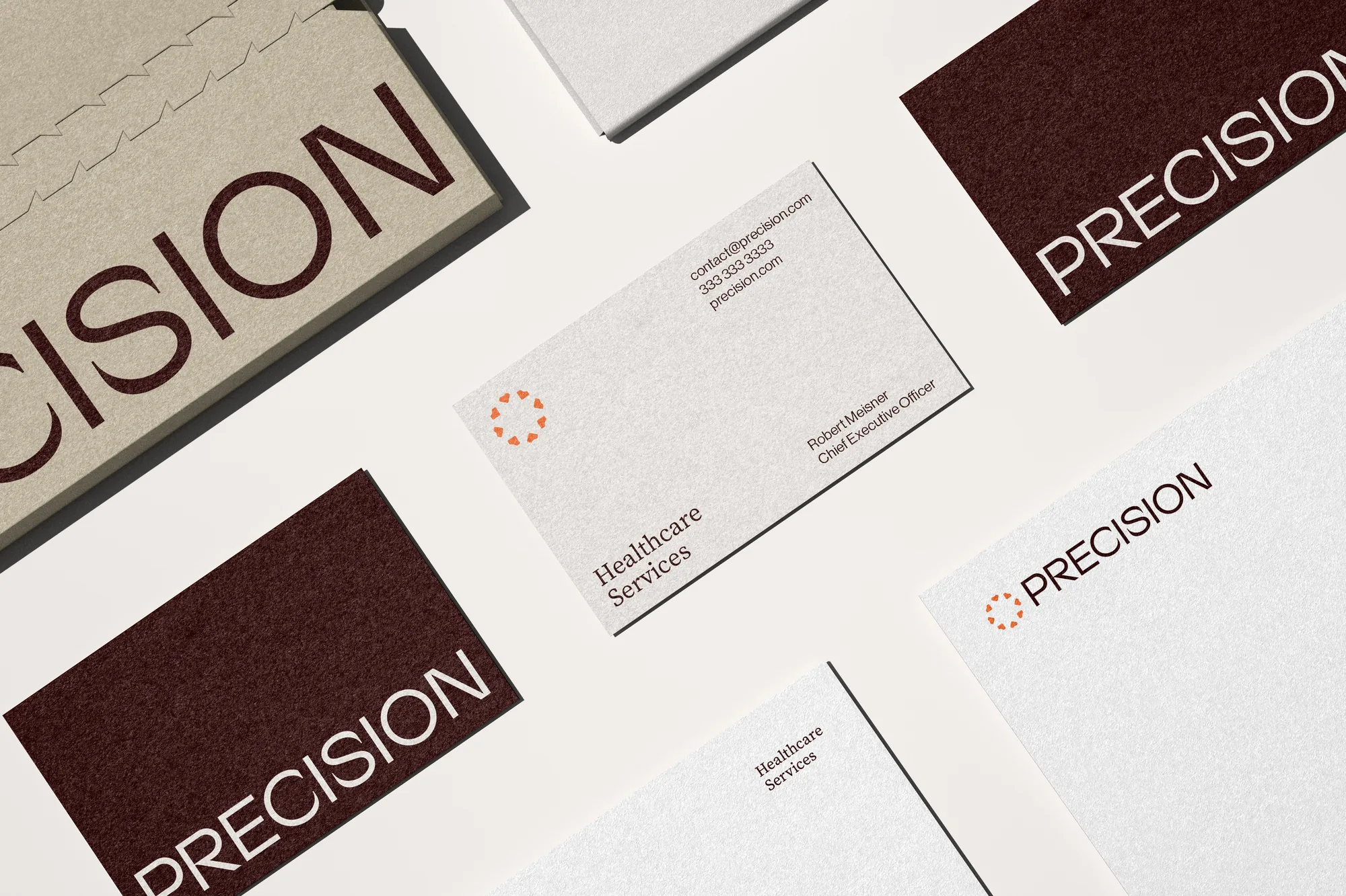 Precision — business cards and letterhead laid out