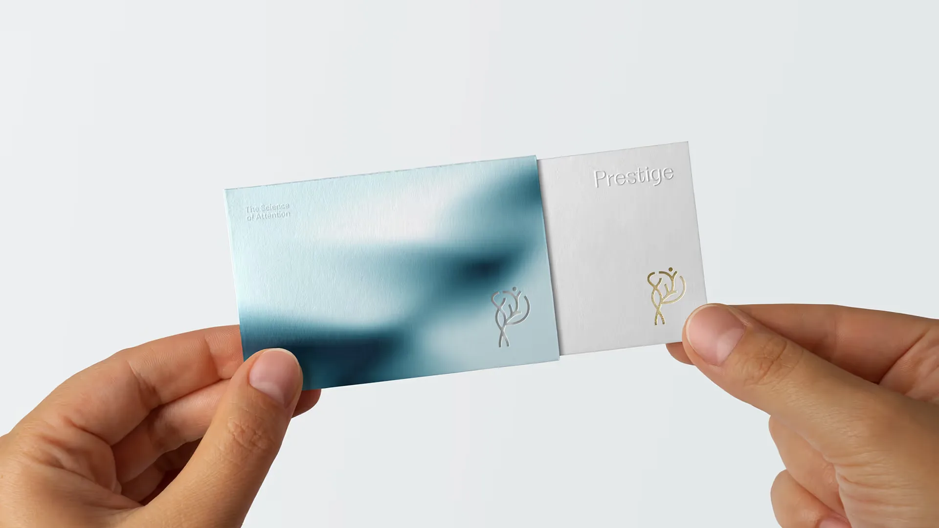 Prestige Healthcare — business cards with the gradient pattern and foil mark