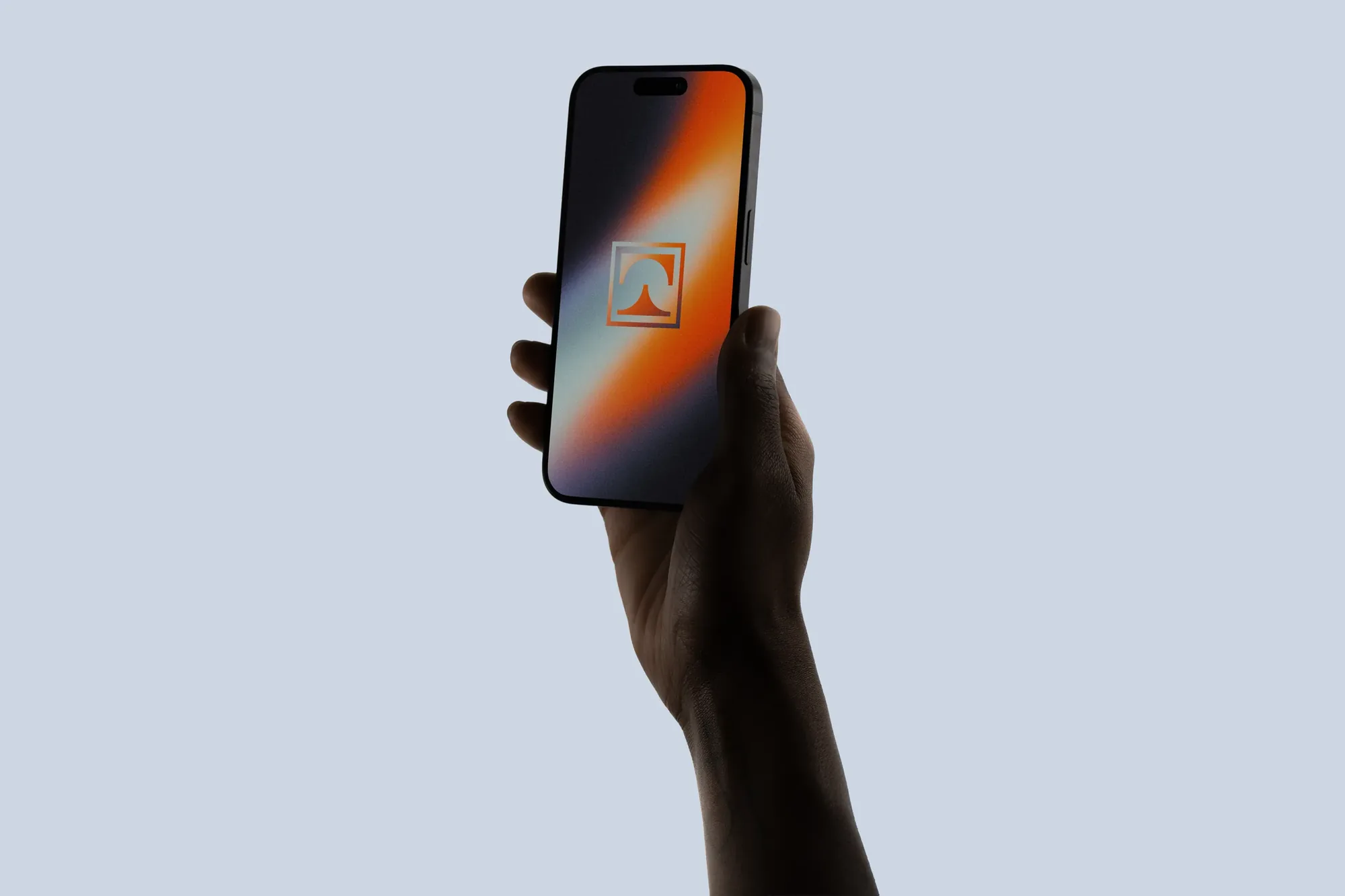 Towne Group — app icon on a phone held up against the sky