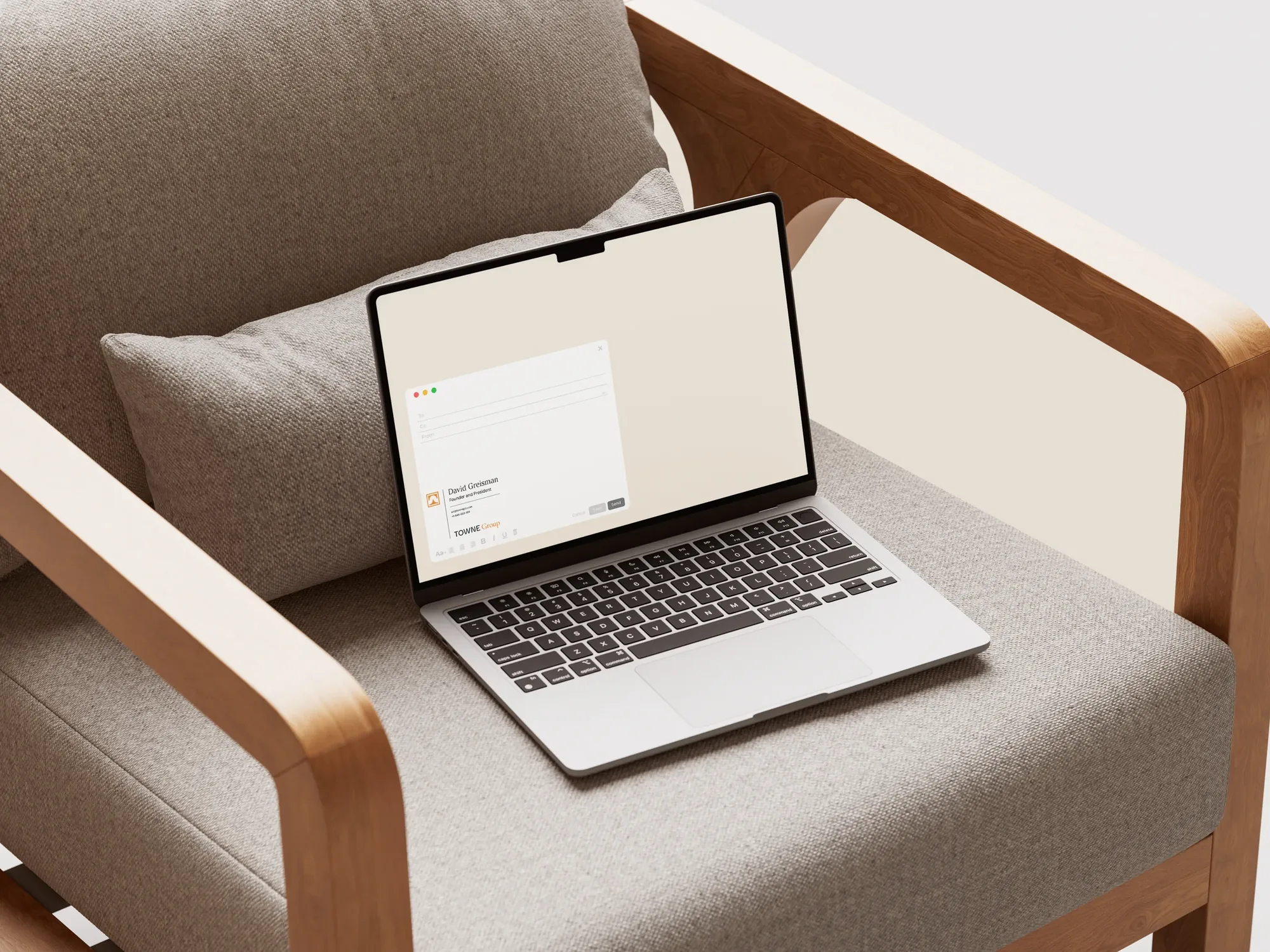 Towne Group — website on a laptop resting on an armchair