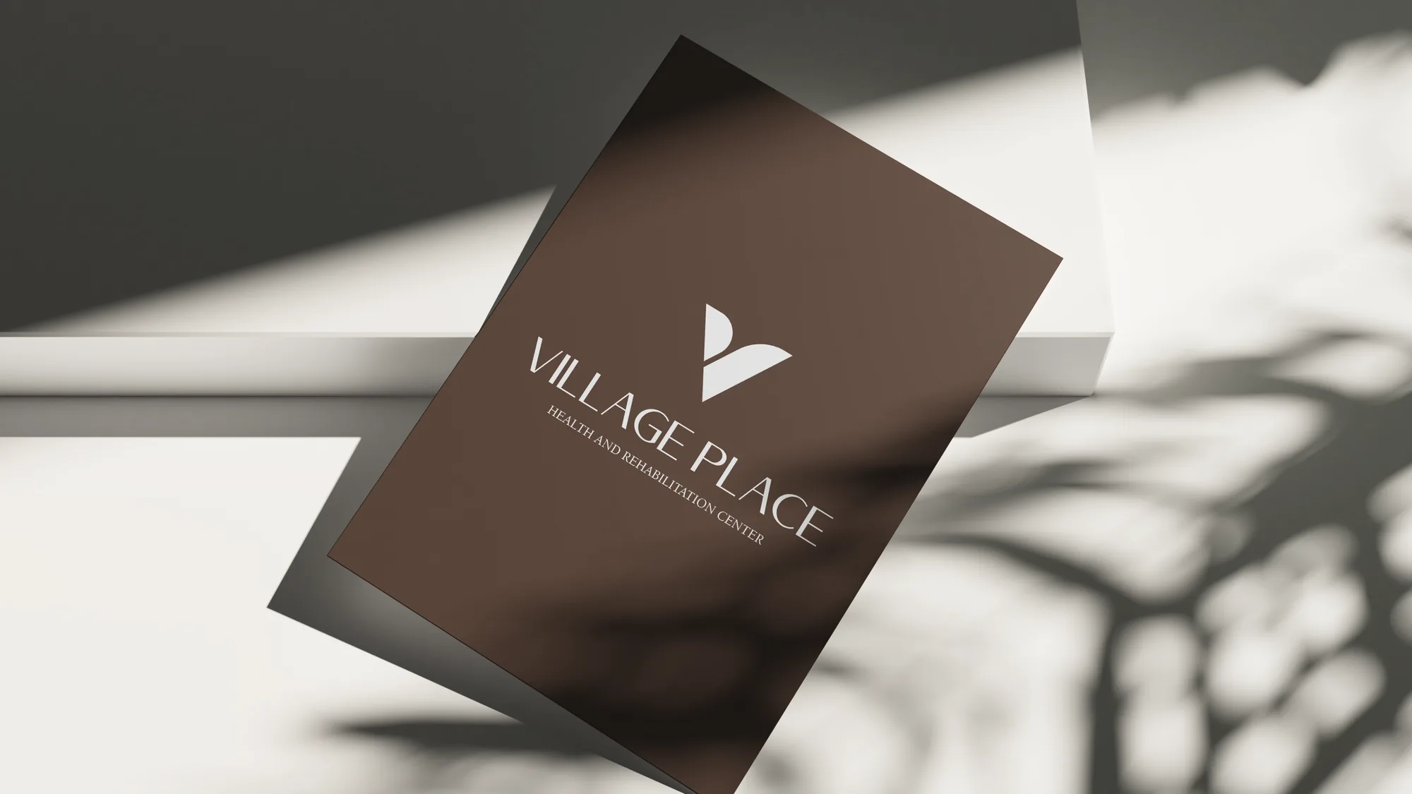 Village Place — brochure cover with the V mark